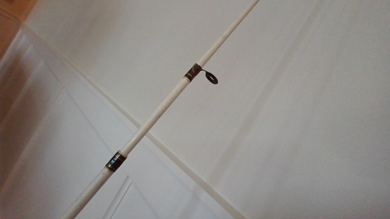 fishing rod white and black. Brand= Shakespearse. Good for redfish and snook.
