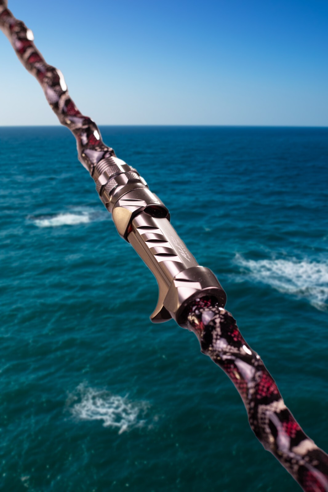 Custom Python Skin Fishing Rod with Real Snake Skin Grips and laminated to tip.