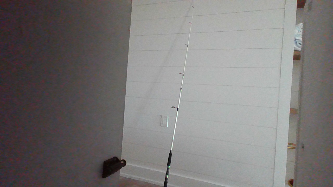 fishing rod white and black. Brand= Shakespearse. Good for redfish and snook.