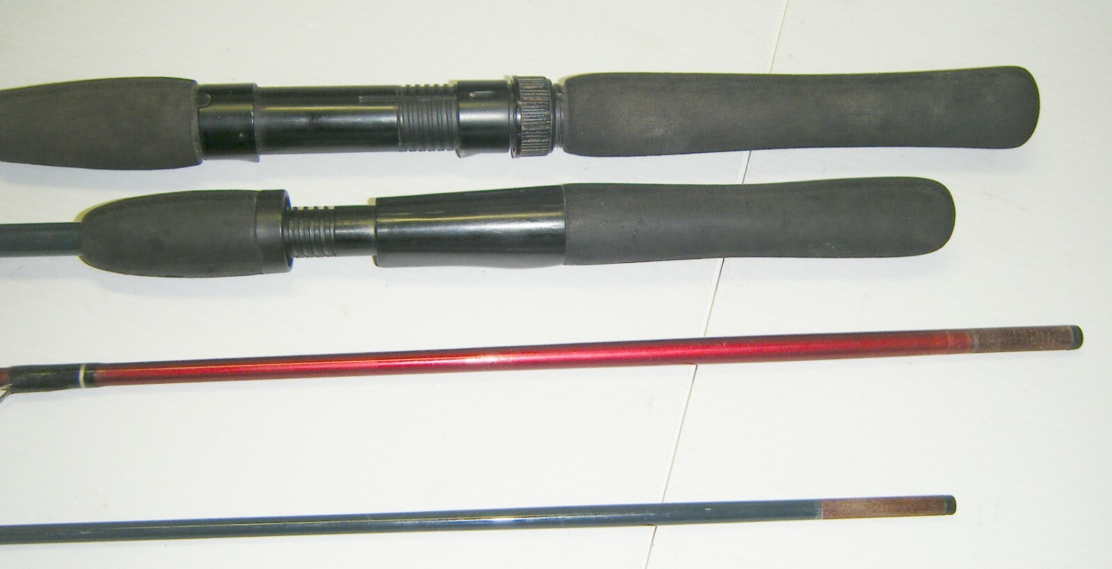 2 Shakespeare 2-Piece Spinning Rods- 1 Firebird 6’6” Med. – 1 Pro-Am 5’6” Light