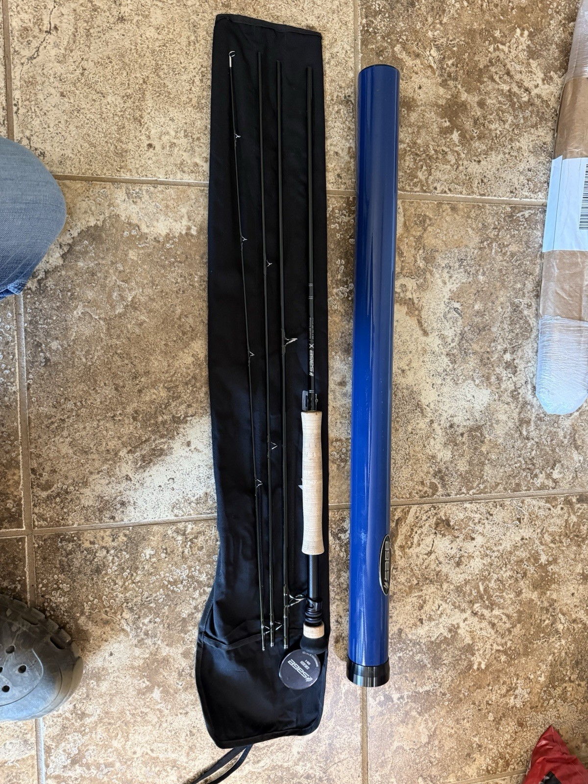 Sage X 890-4 Fly Rod 8 wt 9ft 4pc with a sage salt tube and sock