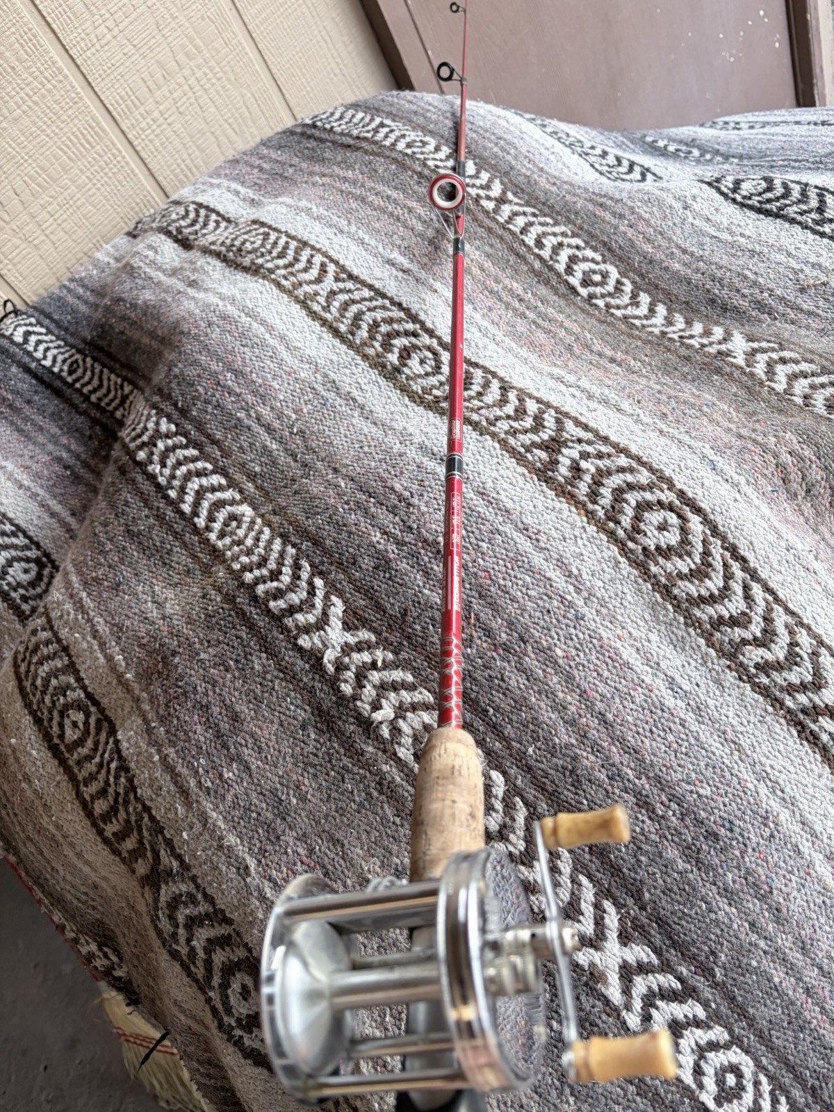 Trump Reel And kwik Stix Fishing Rod. Great Condition Ready To Cast Red Rod