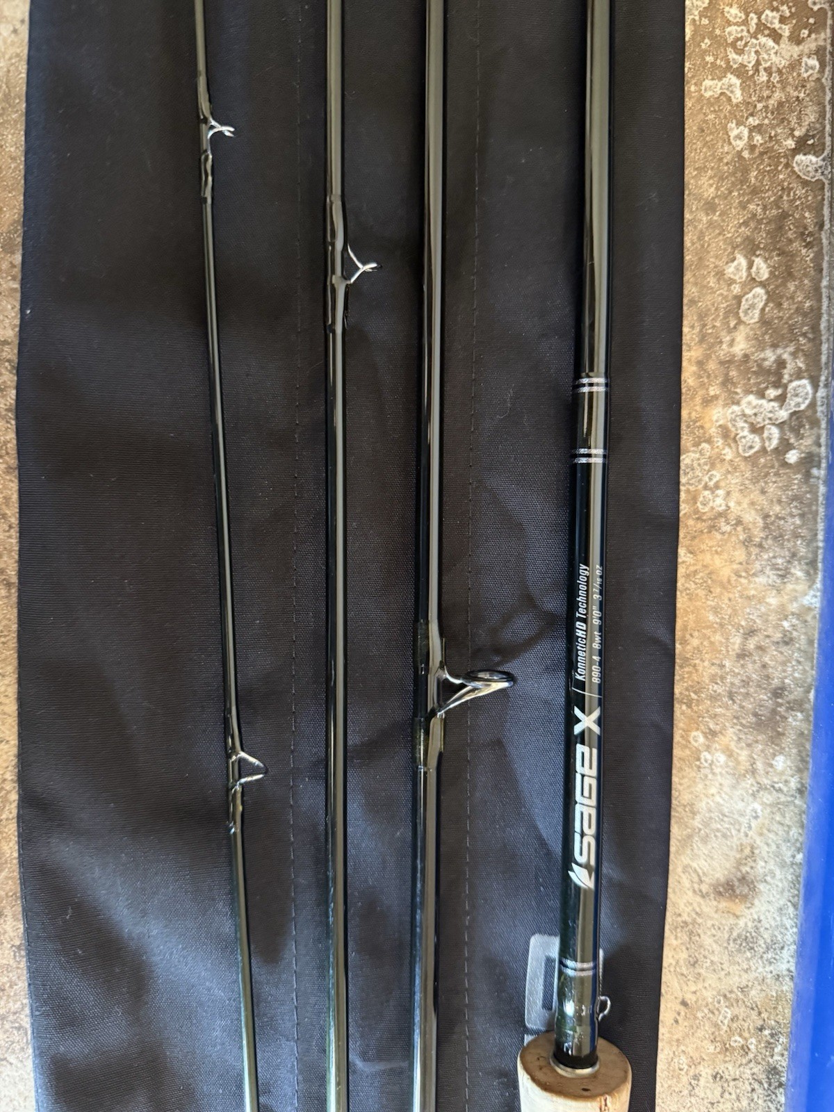 Sage X 890-4 Fly Rod 8 wt 9ft 4pc with a sage salt tube and sock
