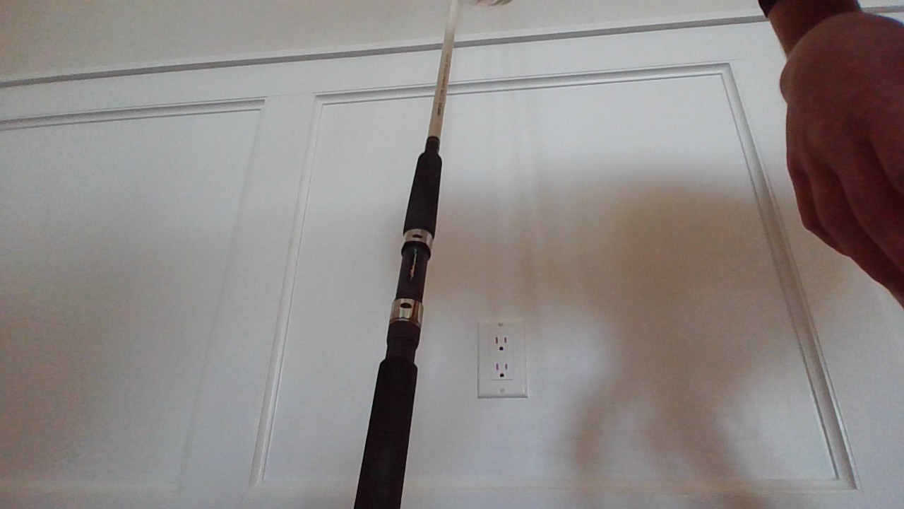 fishing rod white and black. Brand= Shakespearse. Good for redfish and snook.
