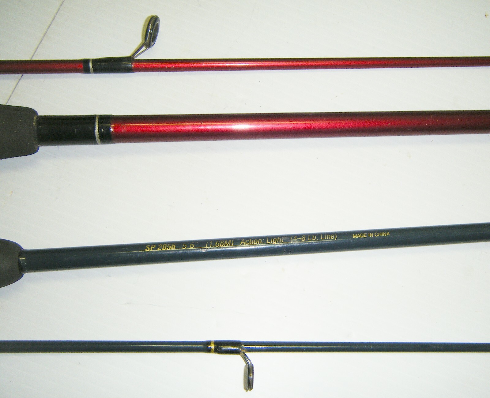 2 Shakespeare 2-Piece Spinning Rods- 1 Firebird 6’6” Med. – 1 Pro-Am 5’6” Light