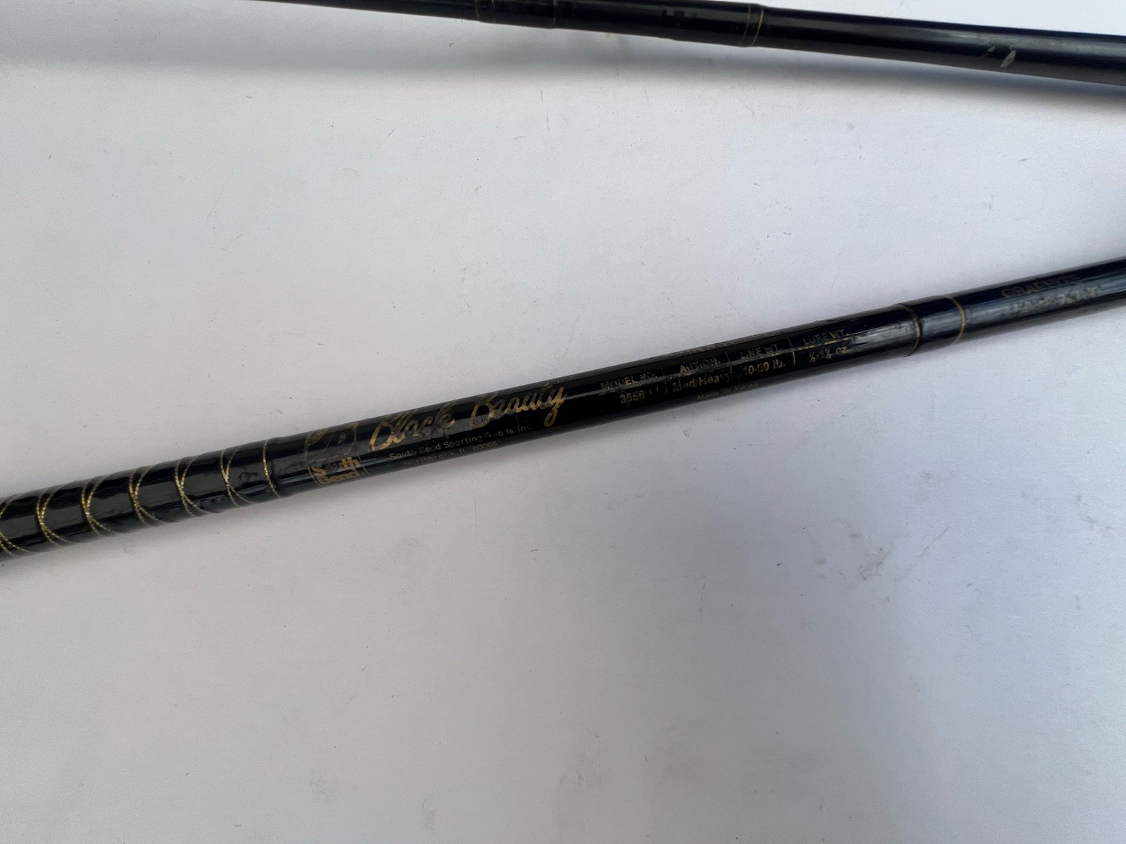 South Bend Black Beauty 2 Piece 10-20lb Spinning Rod Fishing pole 3556 Vintage 7
